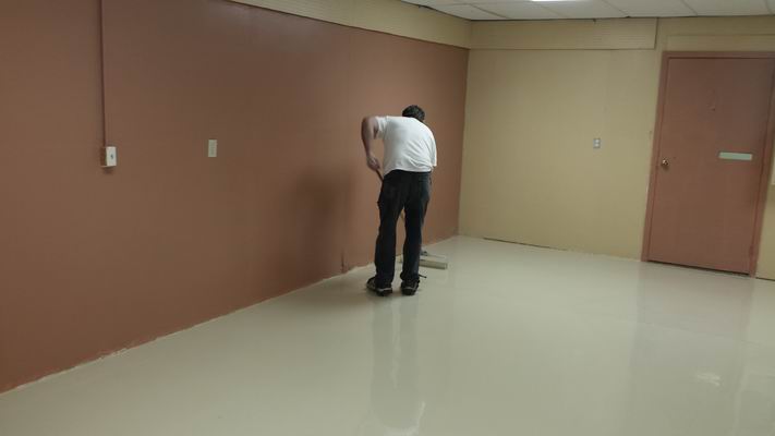 John rolling the paint onto the Hobby Room Floor
