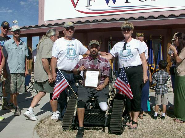 QIA Howard & Sandy Andreasen with Jesus De La Cruz at VFW presentation